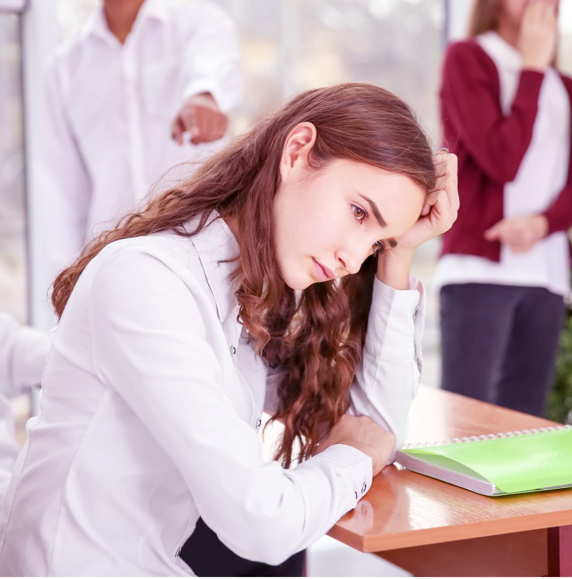 Unhappy teenage girl at school