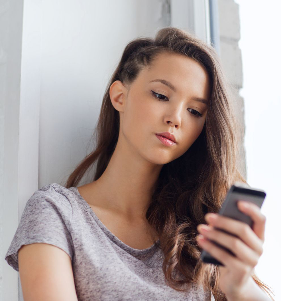 Teenage girl viewing social media which causes anxiety